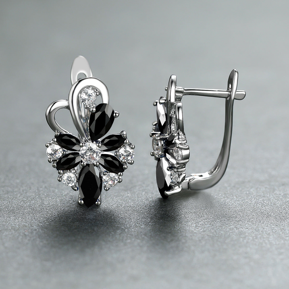 Flower drop-shaped zircon earrings with black and clear stones in silver-tone settings