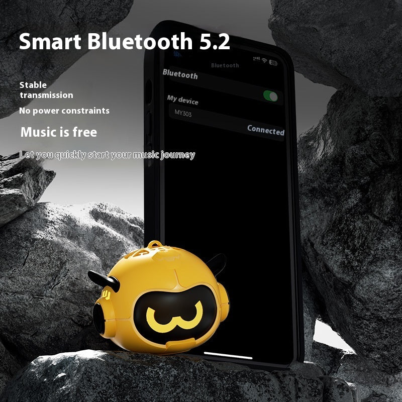 Yellow mini Bluetooth speaker with cartoon face, paired ear-like side speakers
