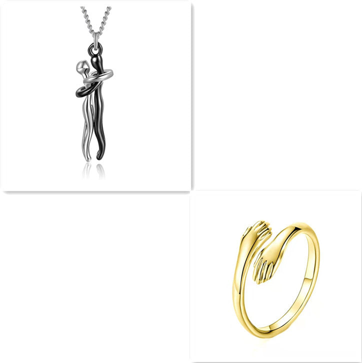 Love hug necklace with silver pendant and gold ring clasp detail