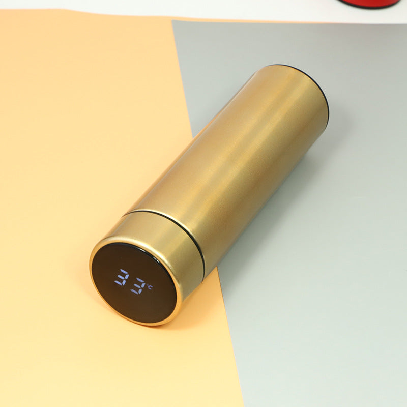 Champagne gold insulated stainless steel bottle with glowing temperature digits