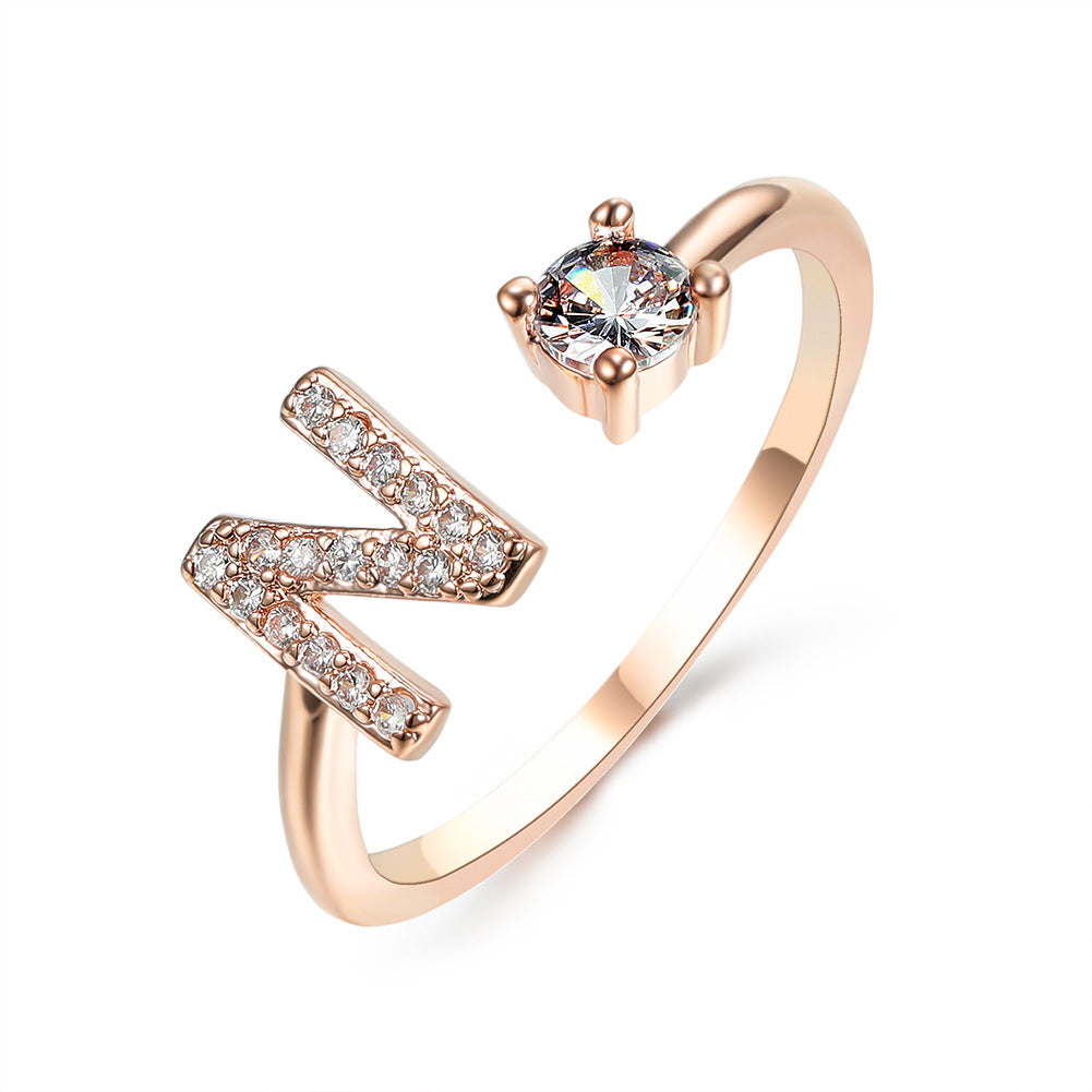 Rose gold initial letter ring with pavé rhinestones and round center crystal
