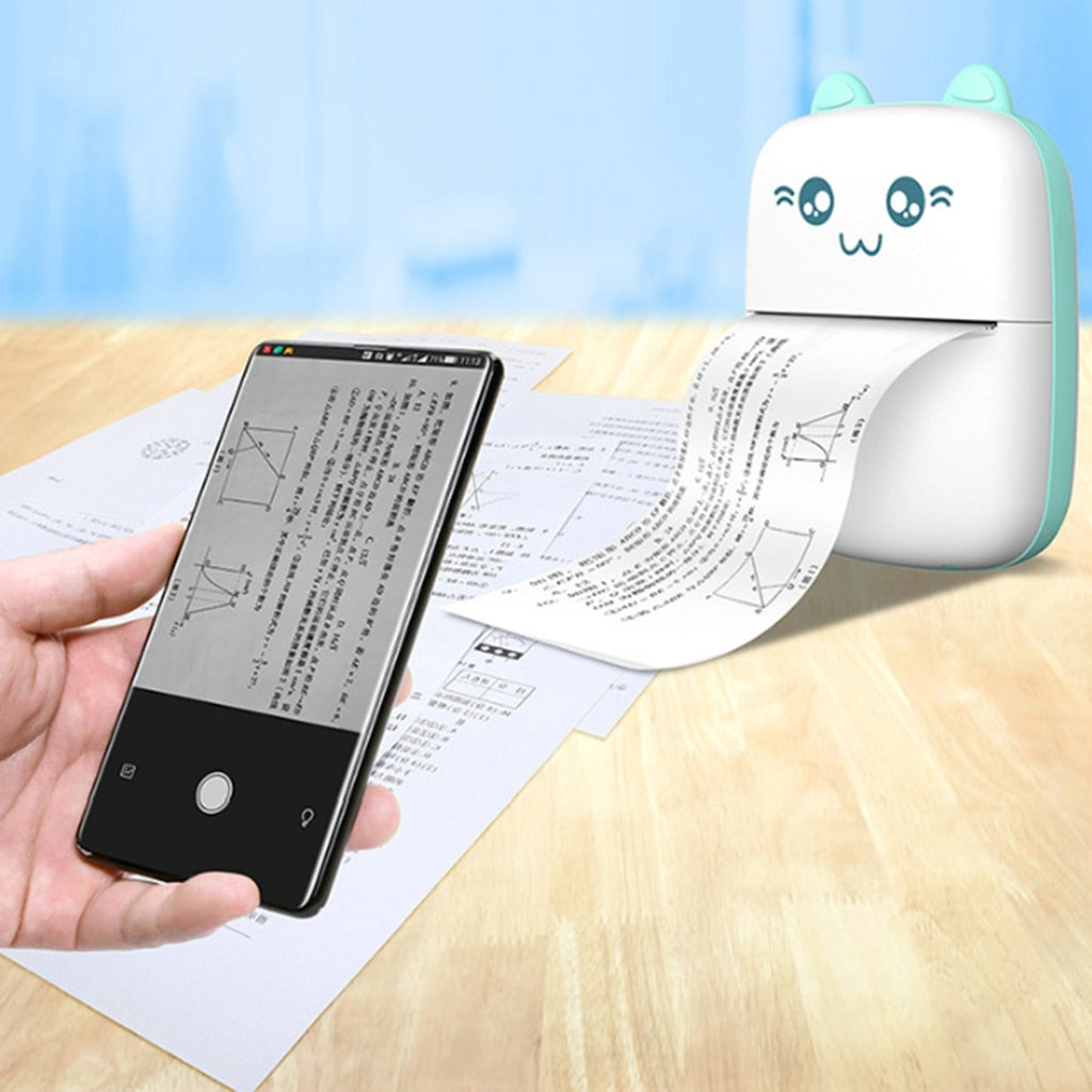 Mini label printer with cat face, mint green body, printed strip coming out