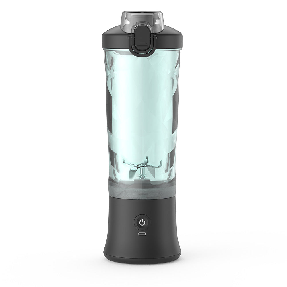 Portable blender with clear blending bottle and black base, with power button and lid