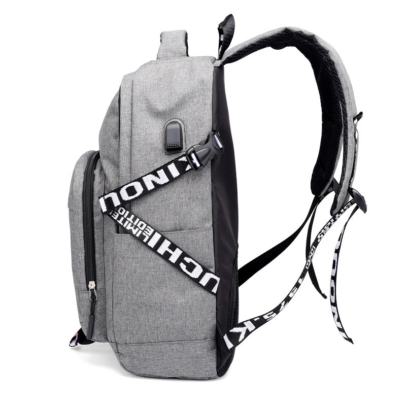 Gray USB laptop backpack viewed from side, with front pocket and adjustable shoulder strap