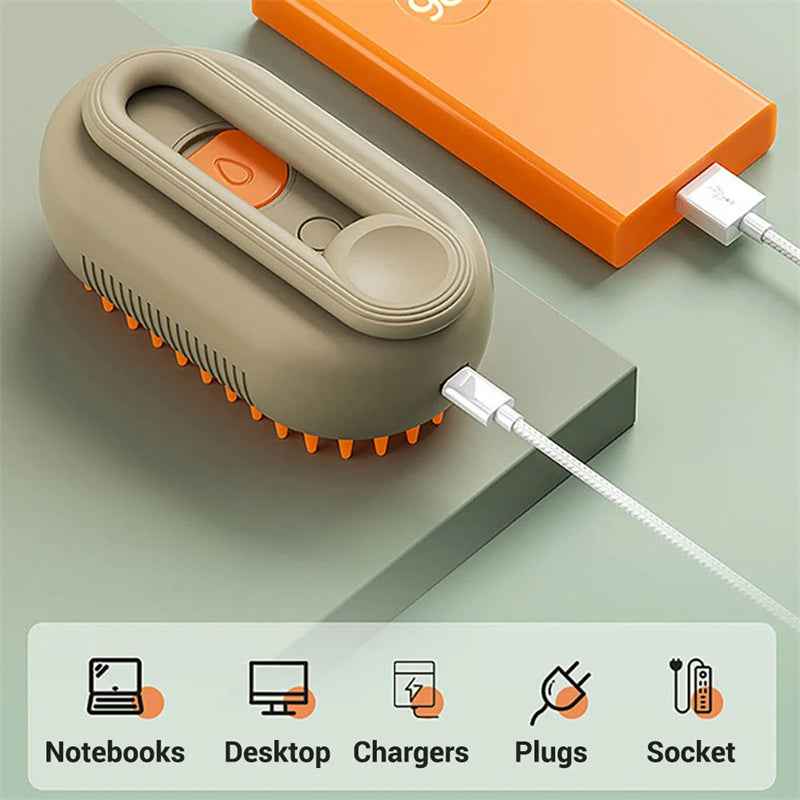 Electric pet grooming brush base with orange bristle underside and charging cable connector