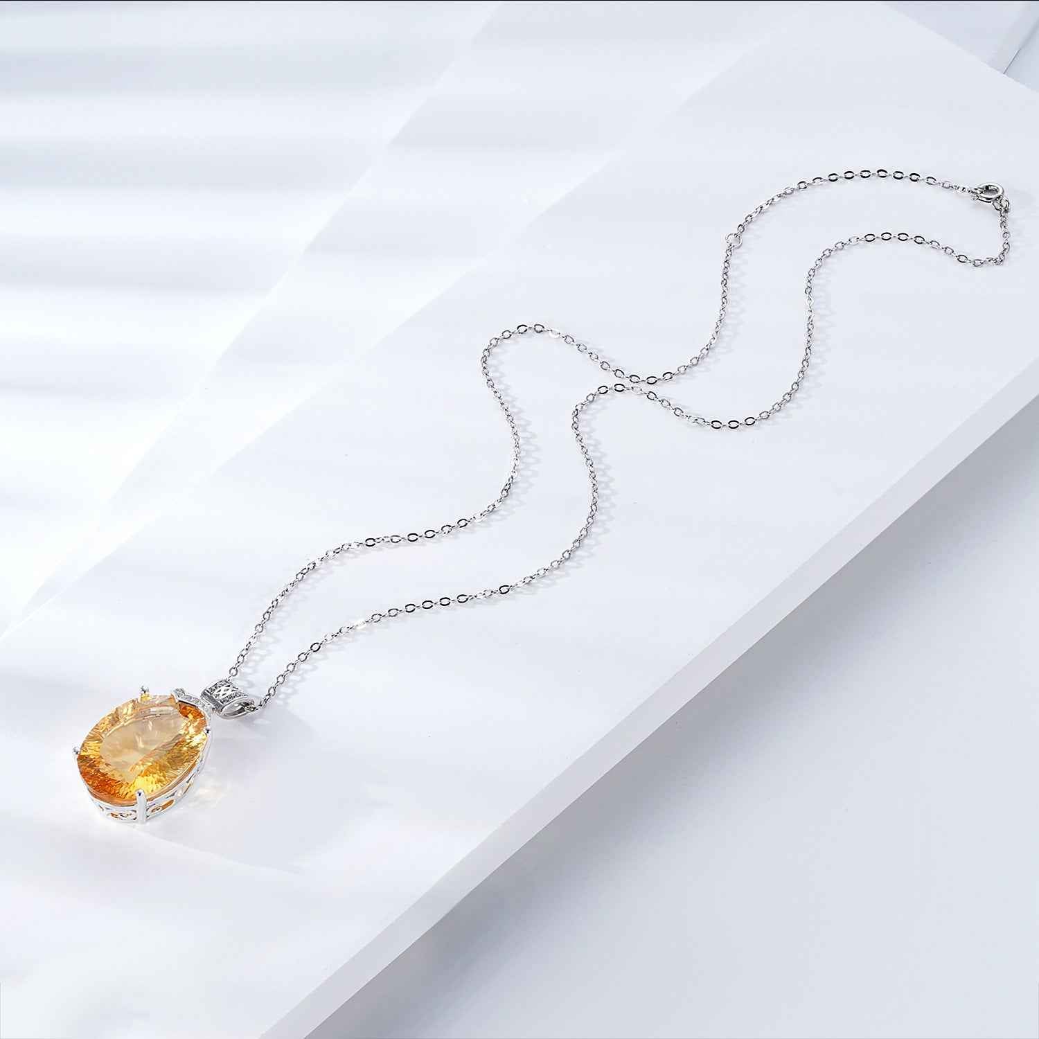 Silver chain necklace with yellow gemstone teardrop pendant