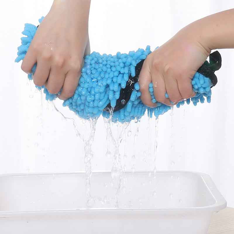 Blue microfiber drying towel being wrung by hands, with shag loops
