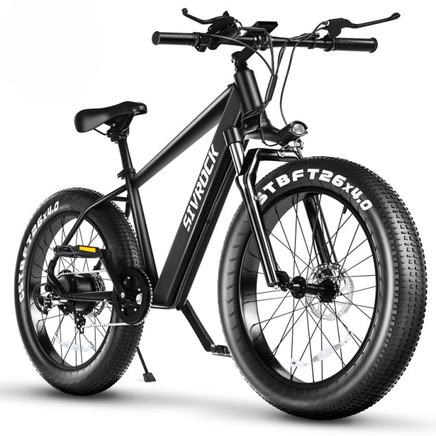 Black electric fat-tire e-bike, handlebars and front wheel with 26x4.0 tires
