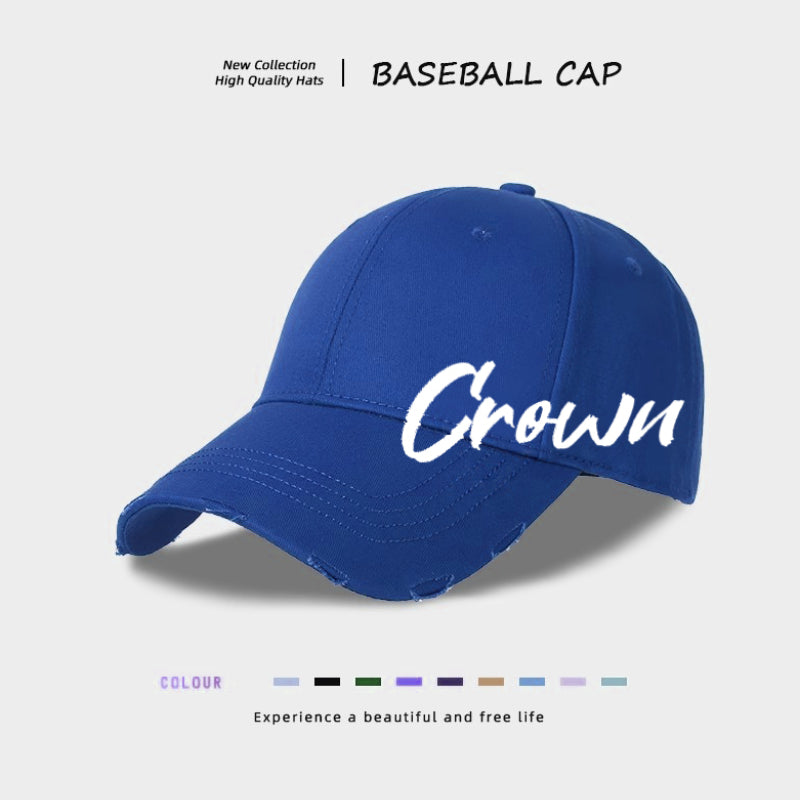 Angled view blue baseball cap with Crown logo embroidery