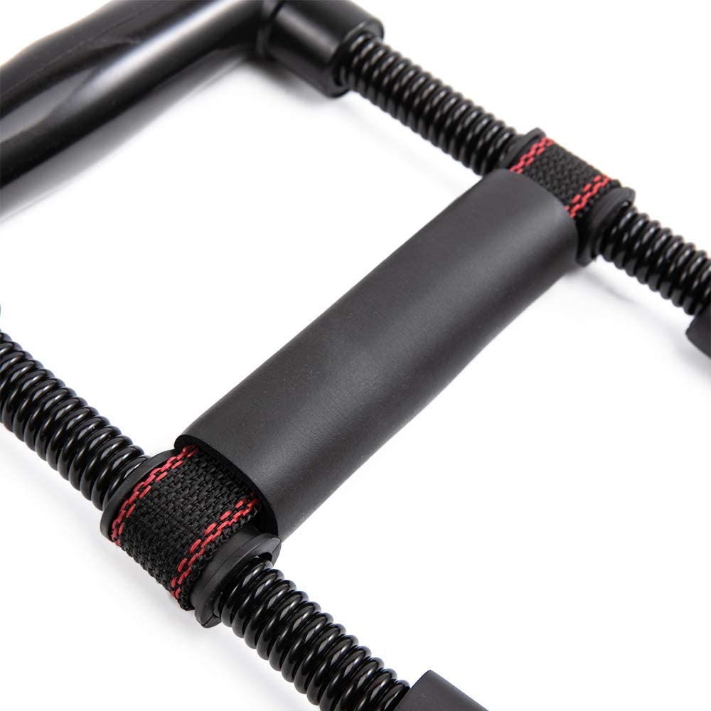 Black grip trainer close-up with padded U handle, spring coils, red trim