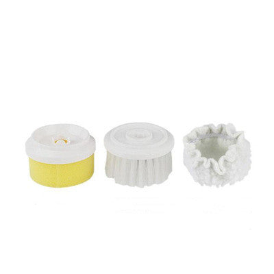 Three detachable scrub brush heads: yellow sponge, white foam, and white brush