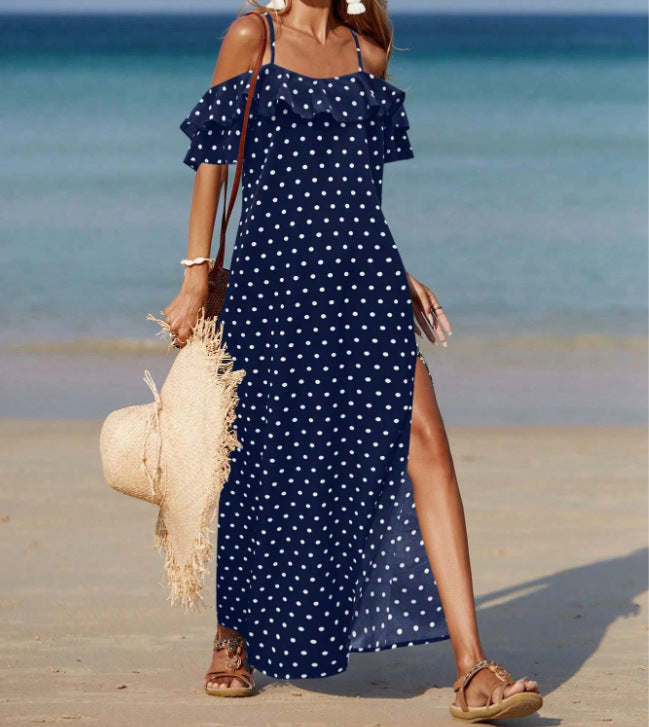 Off-shoulder long polka dot dress in navy with white dots, ruffled sleeves and side slit