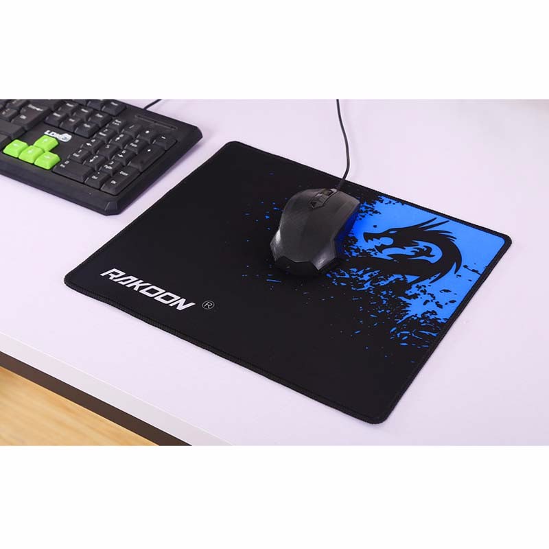 Mouse pad with black surface and blue dragon logo, wired gaming mouse on top