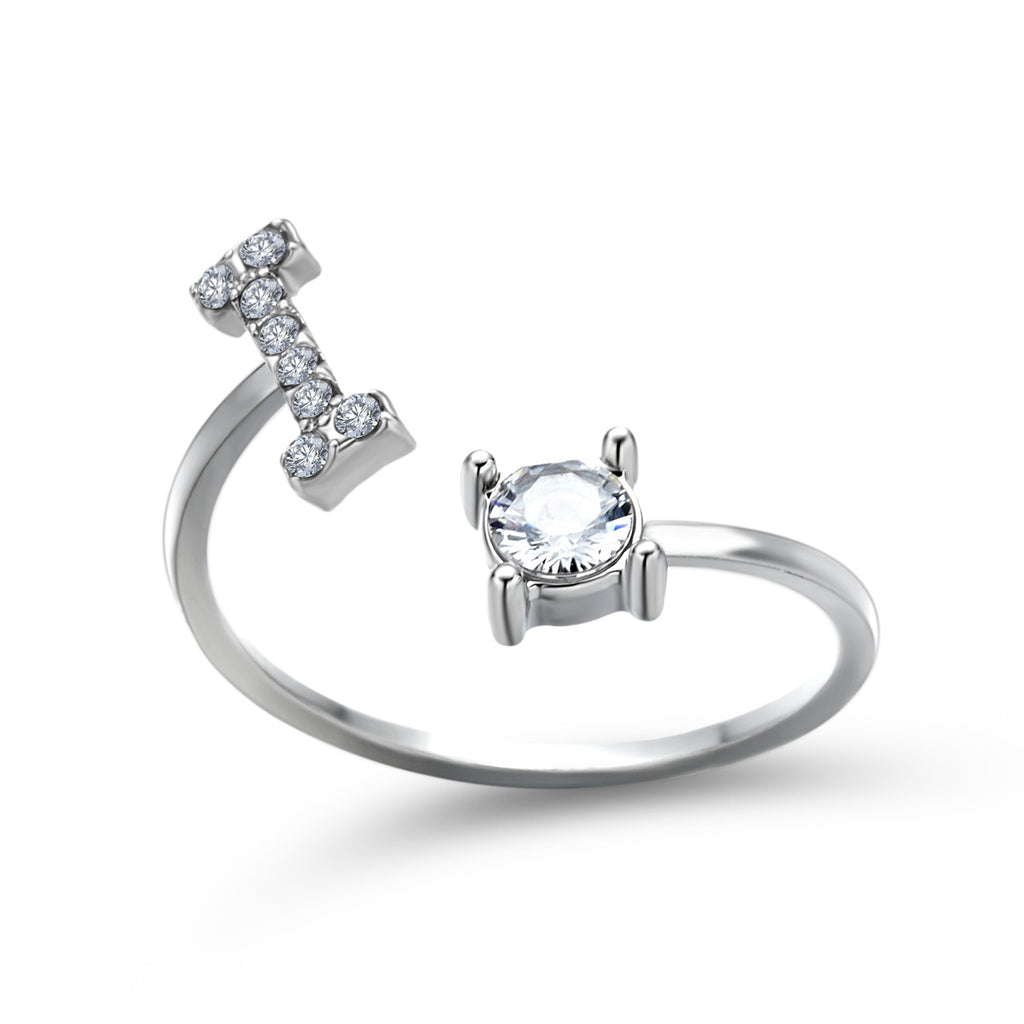Silver adjustable initial letter ring with oval center stone and pave details.