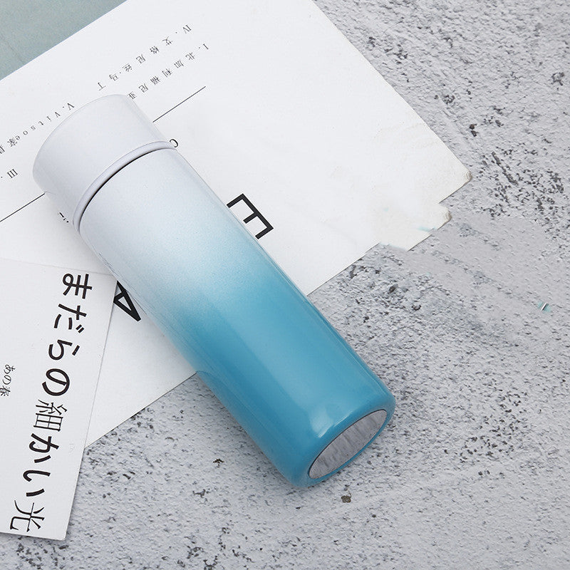 Vacuum insulated stainless steel bottle cup, light blue gradient with black base and lid