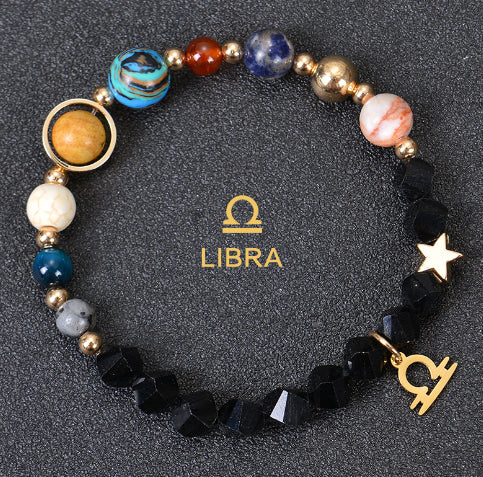 Zodiac beaded bracelet with black faceted beads, gold spacers, Libra charm and star
