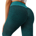 Teal green seamless high-waist leggings with textured honeycomb pattern, full coverage