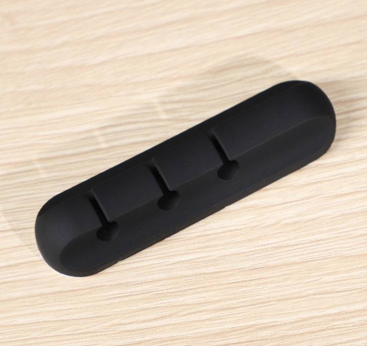 Black silicone cable organizer bar with evenly spaced clip pegs