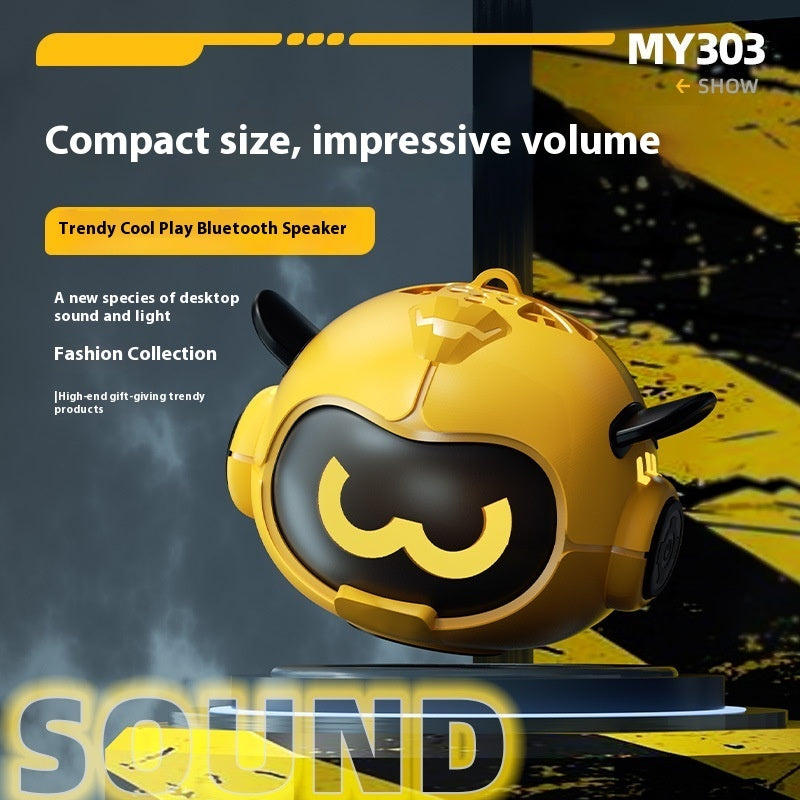 Yellow mini Bluetooth speaker with cartoon face, twin side horns, and small wheels