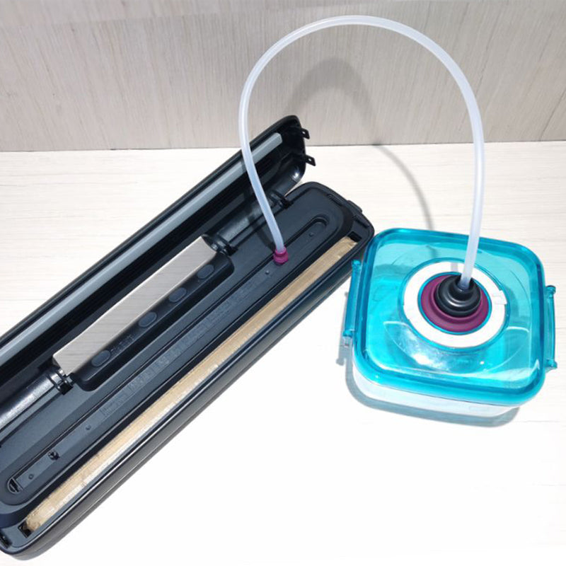 Vacuum sealer with nozzle hose and a blue vacuum container beside the sealing unit