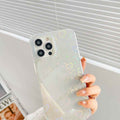 Translucent silicone phone case with pastel heart pattern and triple camera cutout