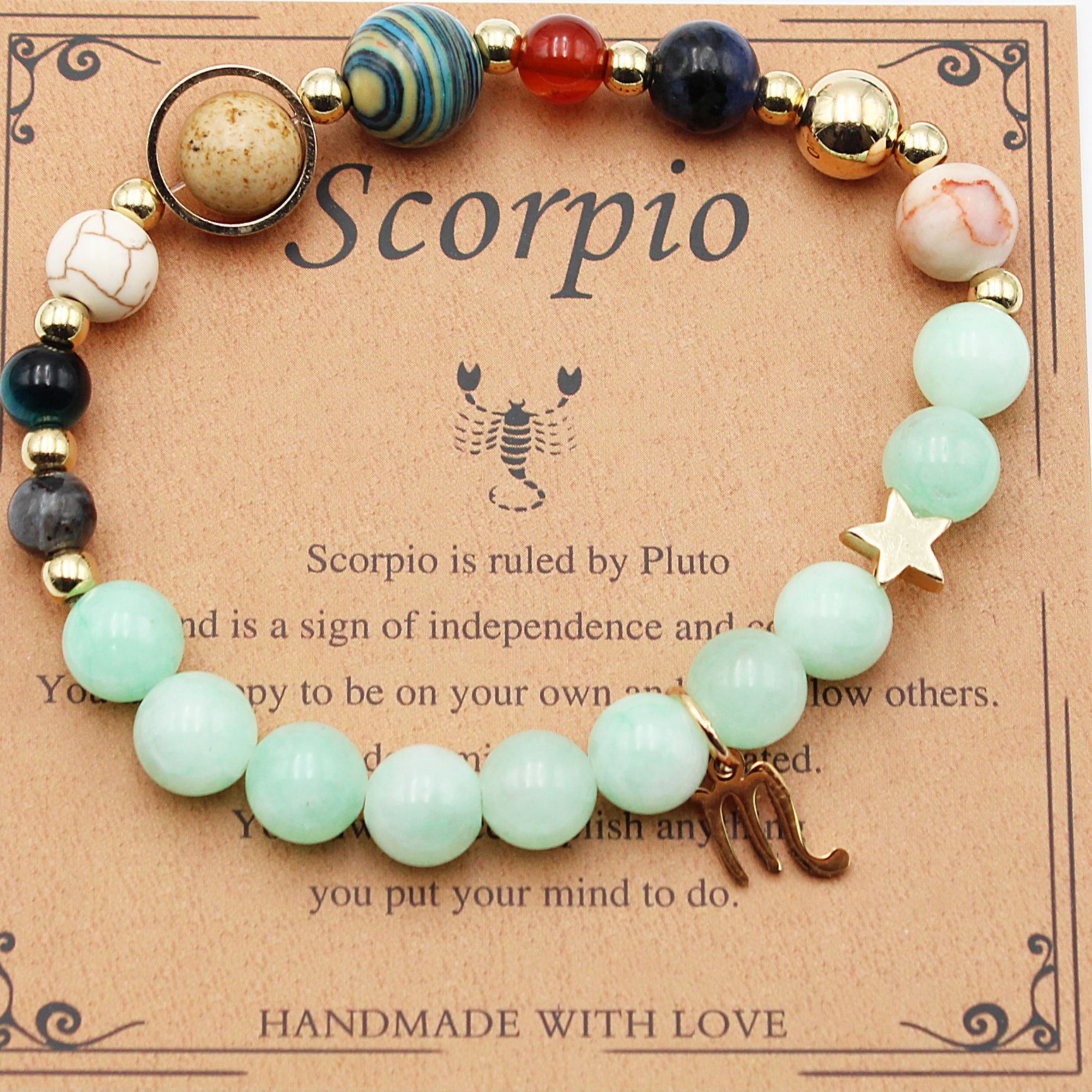 Beaded zodiac bracelet with mint green beads, gold spacers, star charm and dark blue beads