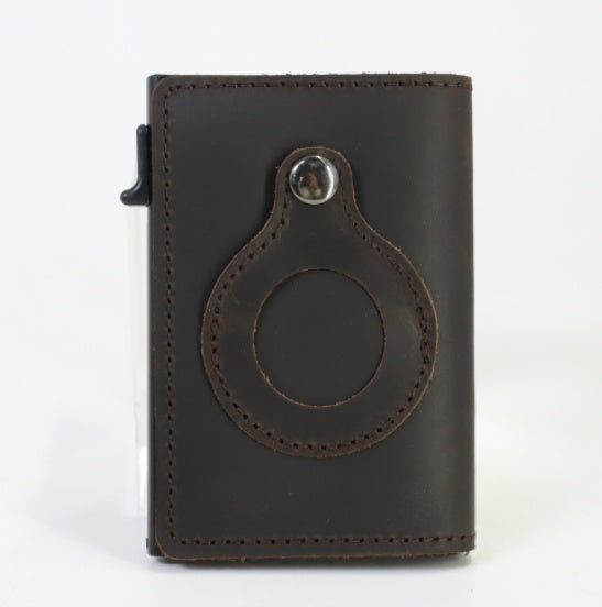 Men's slim card wallet in dark brown leather with round tag holder and metal top rivet.