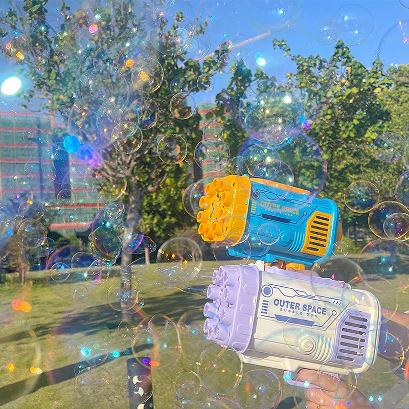 Purple and light-blue bubble gun toy with multiple nozzles, releasing soap bubbles outdoors