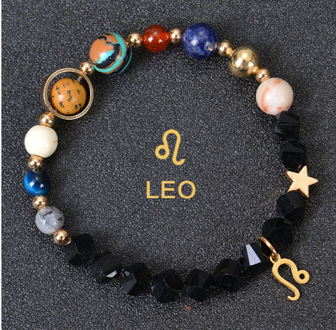 Zodiac beaded bracelet with black faceted beads, gold spacers, Leo charm and star
