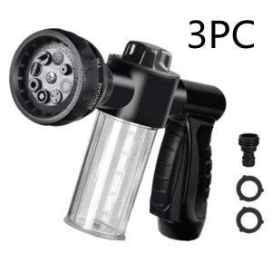 Foam spray gun with clear bottle, black handle, round nozzle head and extra fittings.