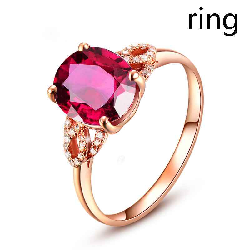 Rose-gold ring with pink gemstone and clear stone accents
