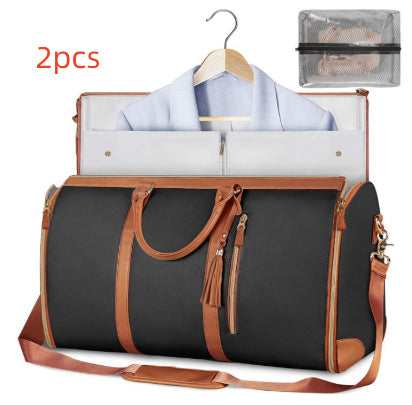 Black travel duffle bag with tan trim, open garment organizer, hanging shirt, mesh top pouch