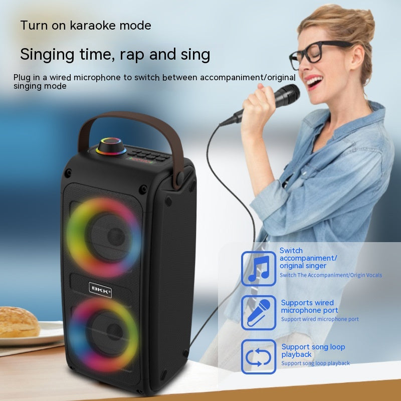 Black portable Bluetooth speaker with dual drivers and multicolor light rings.