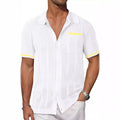 Men’s short-sleeve knit shirt, white, button-front with chest pocket and yellow contrast trim.