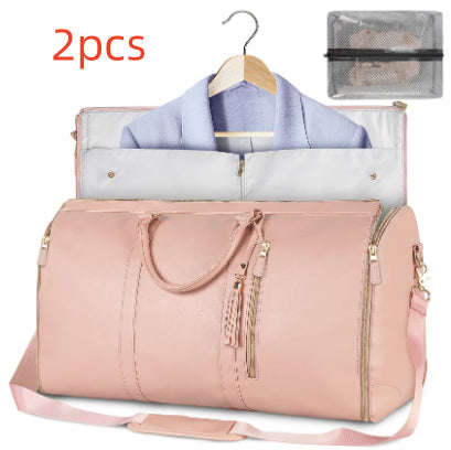 Pink travel duffle bag, open garment organizer with hanging shirt, tassel zippers, shoulder strap