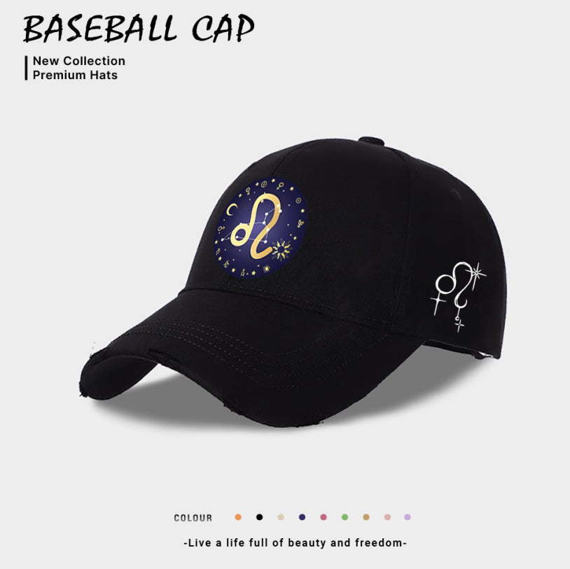 Black baseball cap with blue-and-gold zodiac emblem on front, white side constellation icon