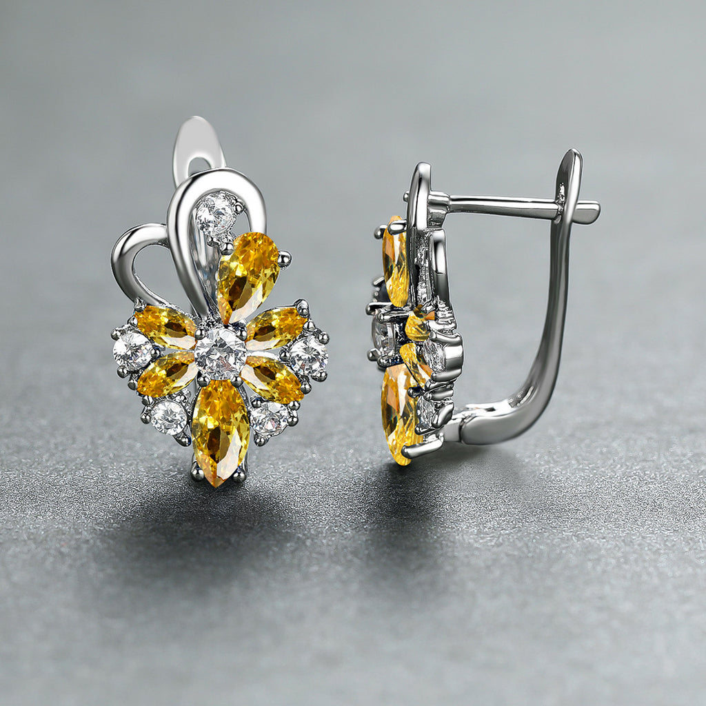 Silver-tone drop earrings with yellow pear and marquise stones, clear flower accents
