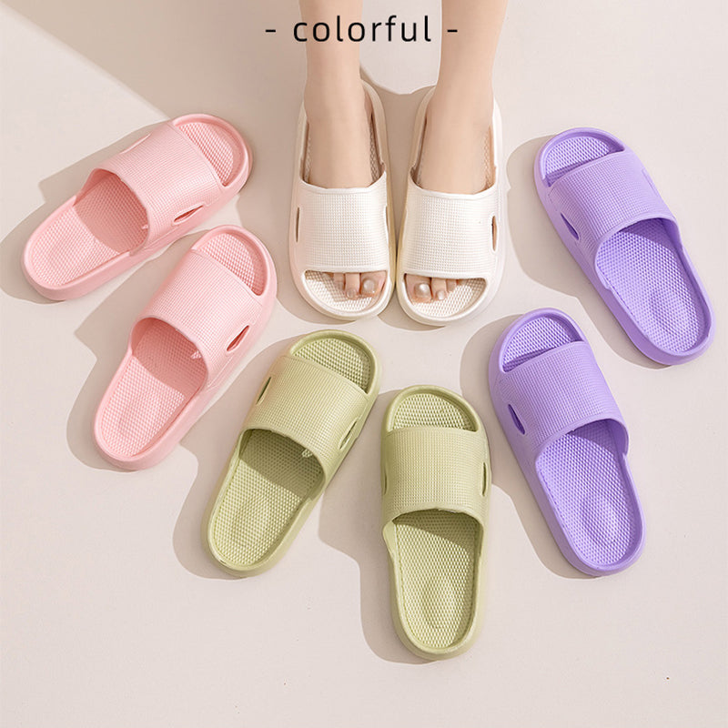 Color assortment of thick-soled slide slippers: pink, white, green, and purple