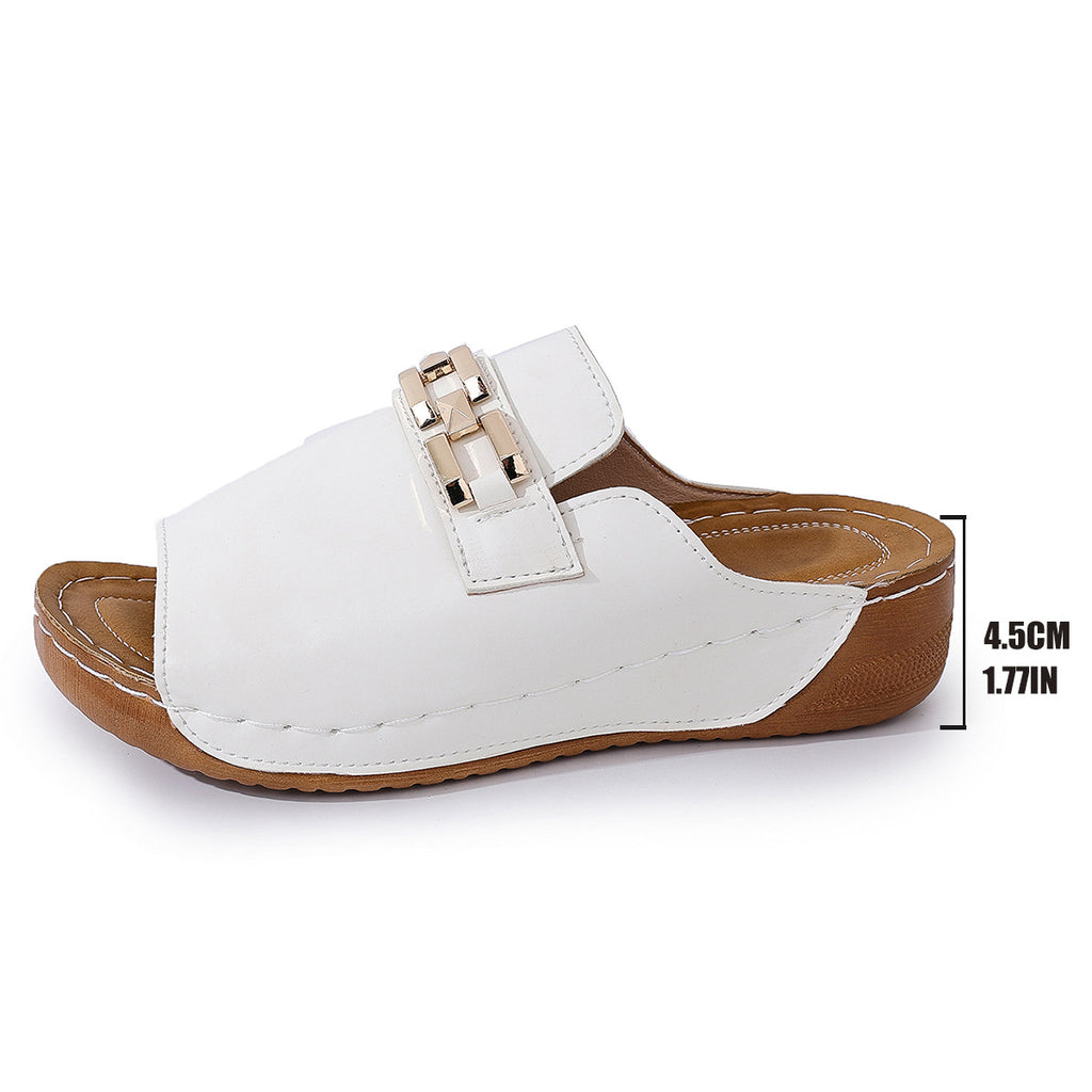 White peep-toe wedge mules with gold metal buckle strap and open toe