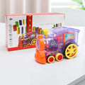 Domino train toy in box with clear purple engine, orange accents, and colorful rails