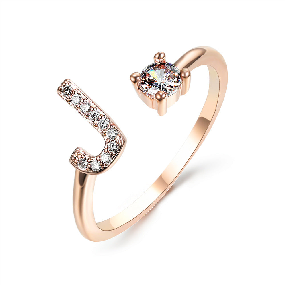 Rose gold initial letter ring with pavé rhinestones and round center crystal