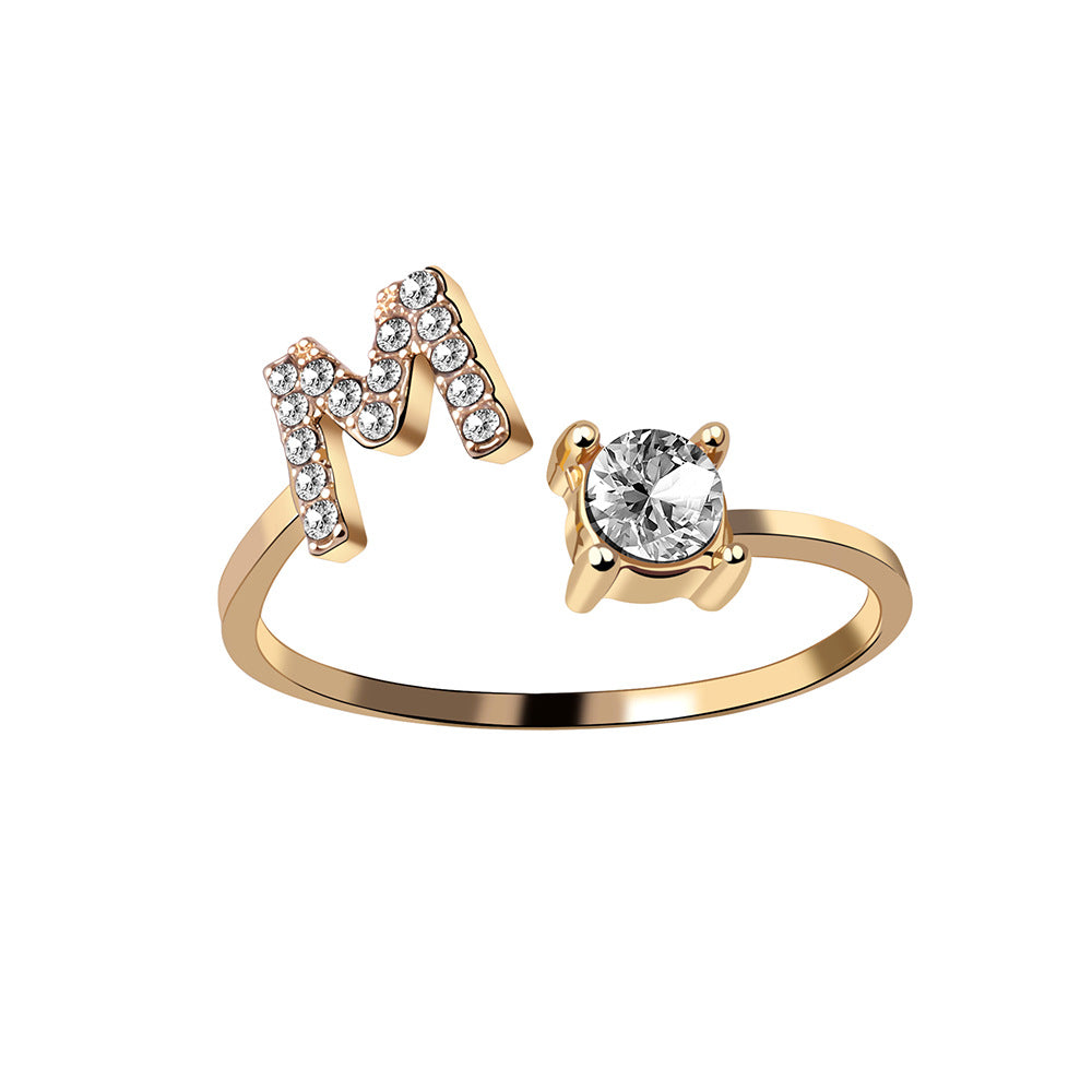 Adjustable initial letter ring with round crystal center and pavé letter detail, rose gold tone
