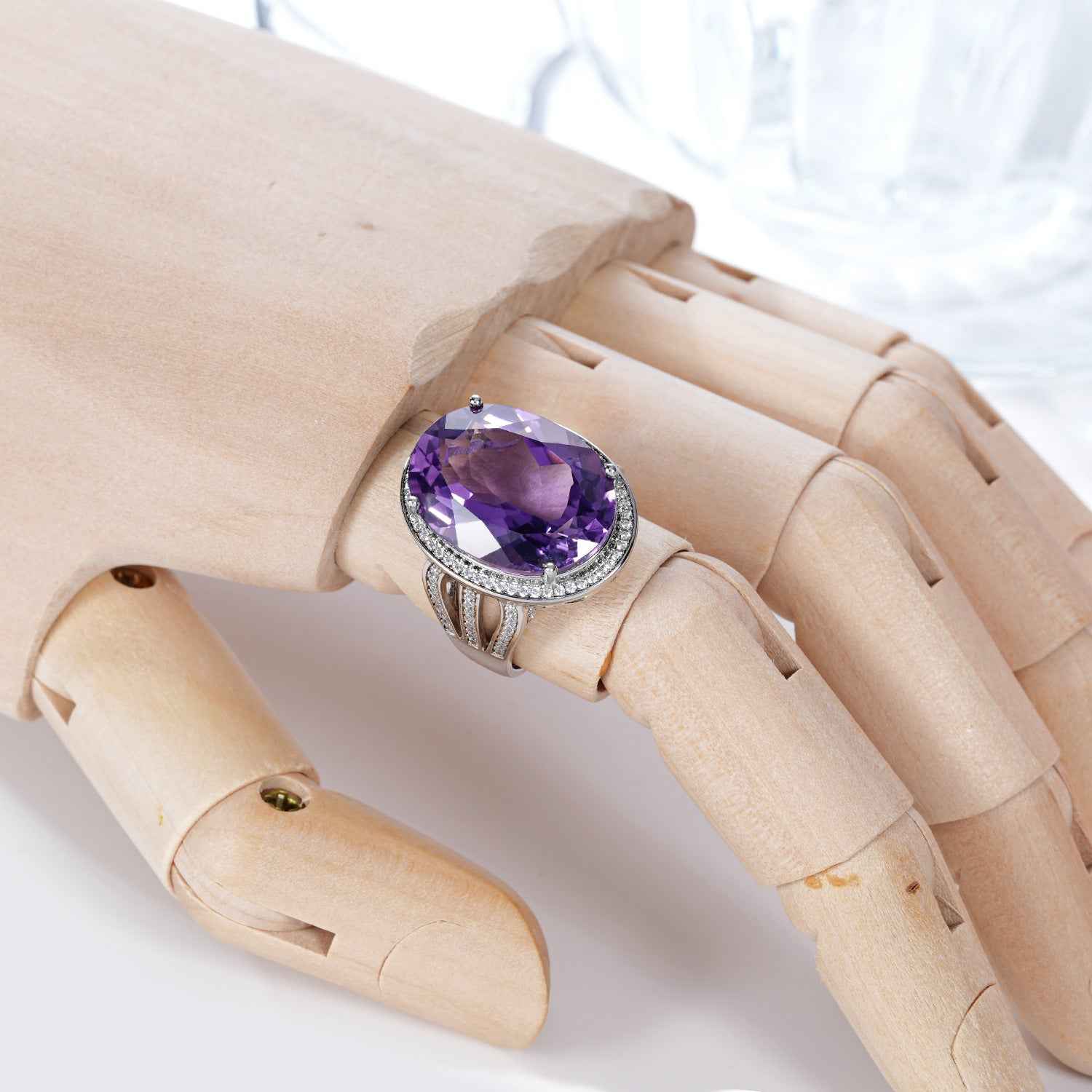 Silver amethyst ring with oval purple stone on openwork band