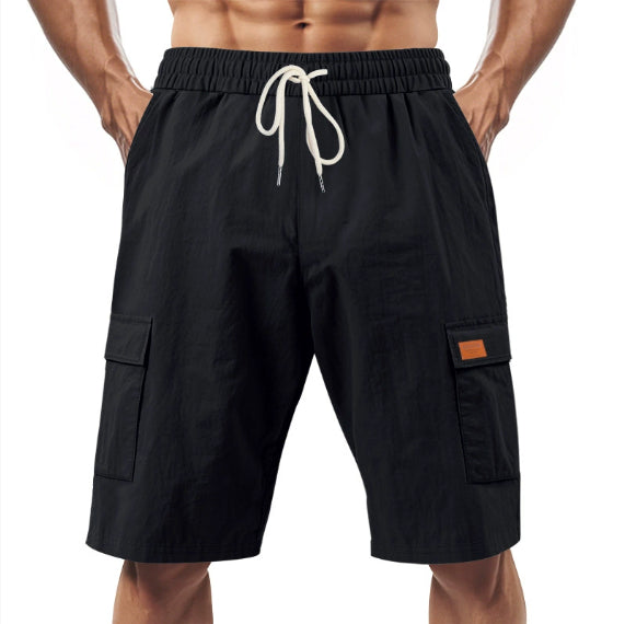 Black linen cargo shorts with elastic waistband and drawstring, side flap pockets