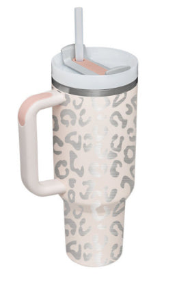 Insulated tumbler with handle, cream leopard pattern, stainless lid and clear straw