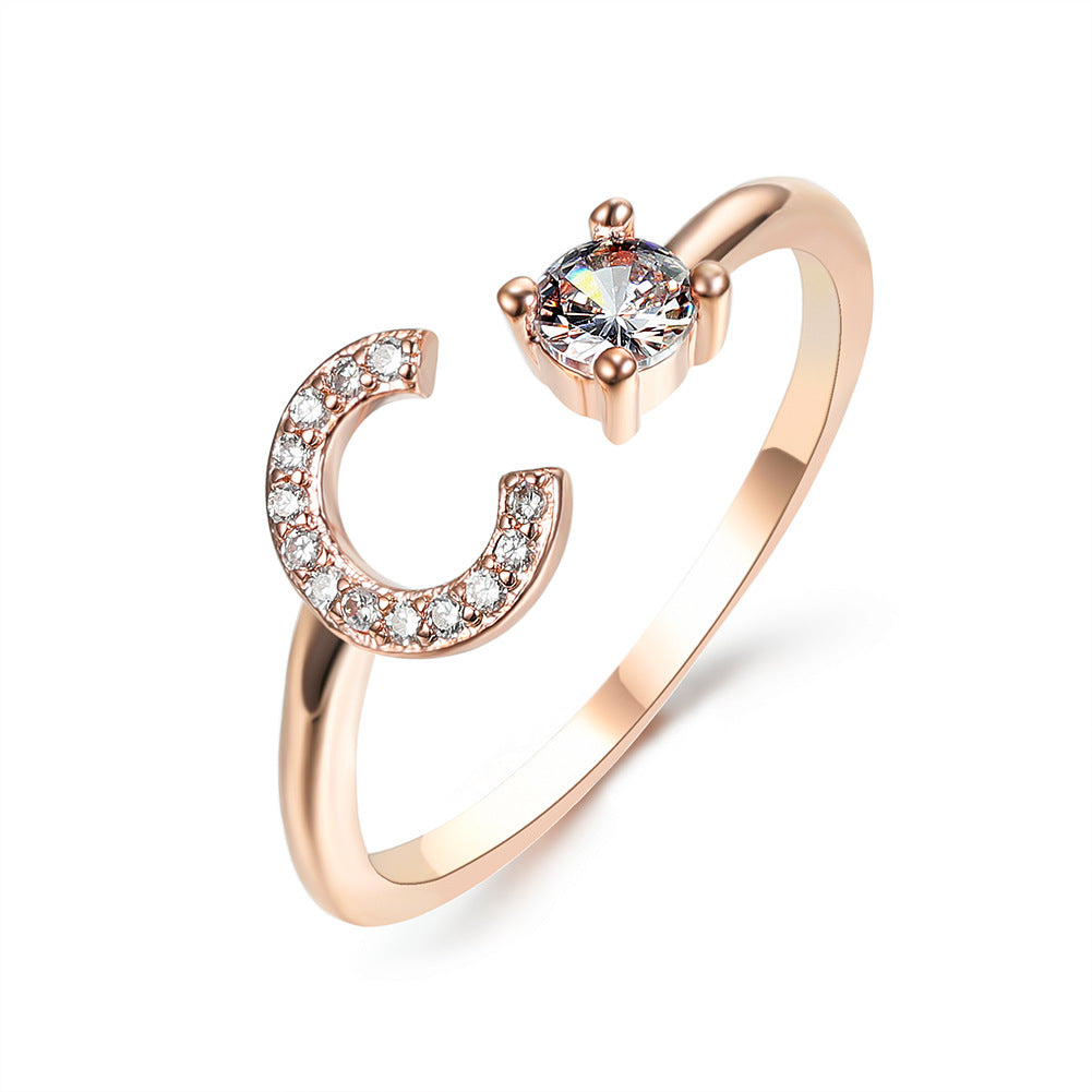 Rose gold initial C ring with round crystal center and pave C detail