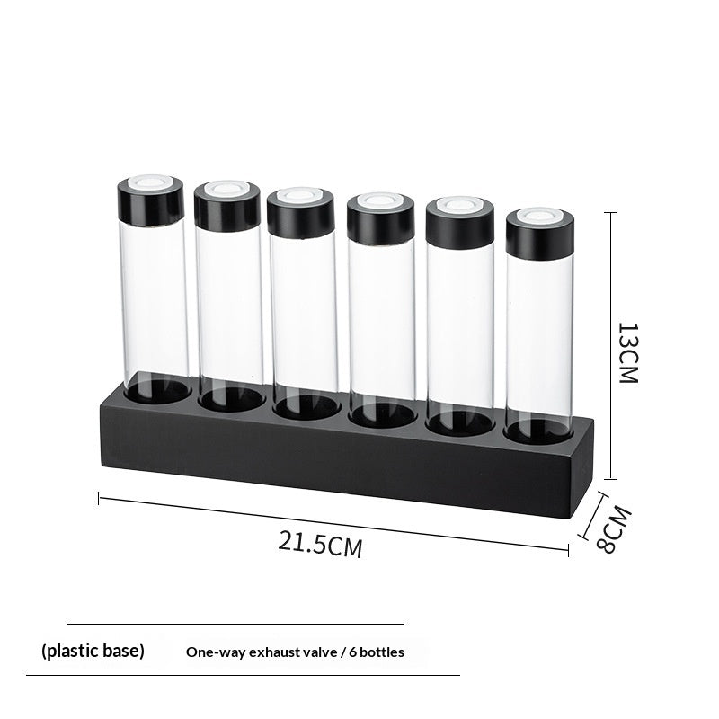 Bottle display rack for 6 bottles: clear tubes with black caps on a plastic base.