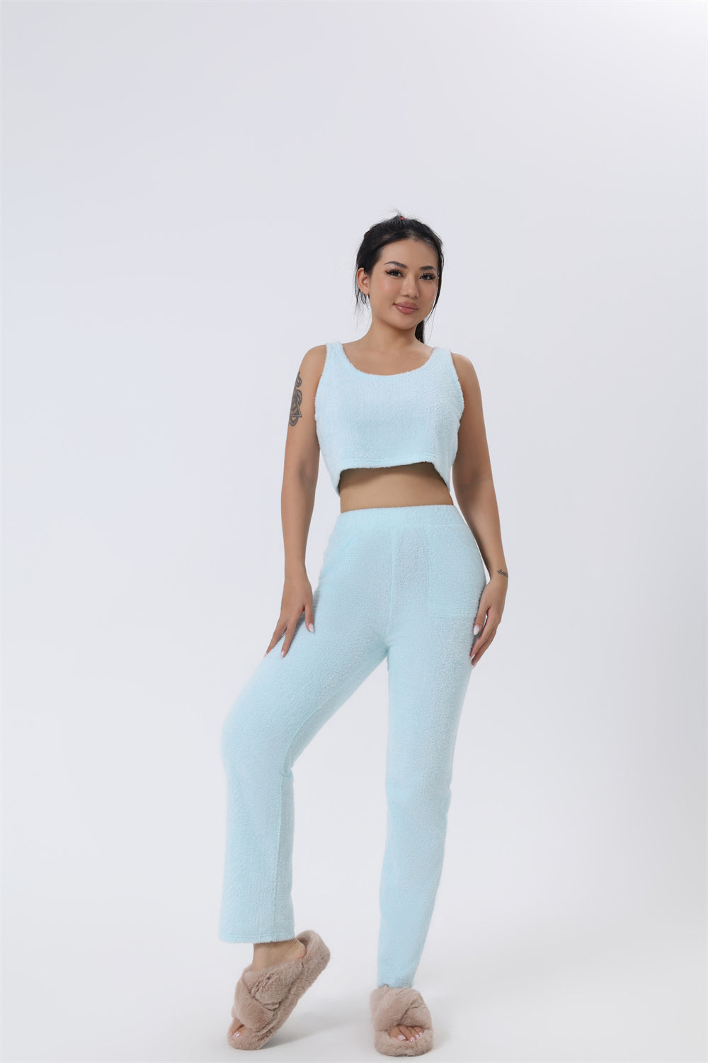 Women’s 3-piece pajama set in light blue: cropped tank top and straight-leg pants.