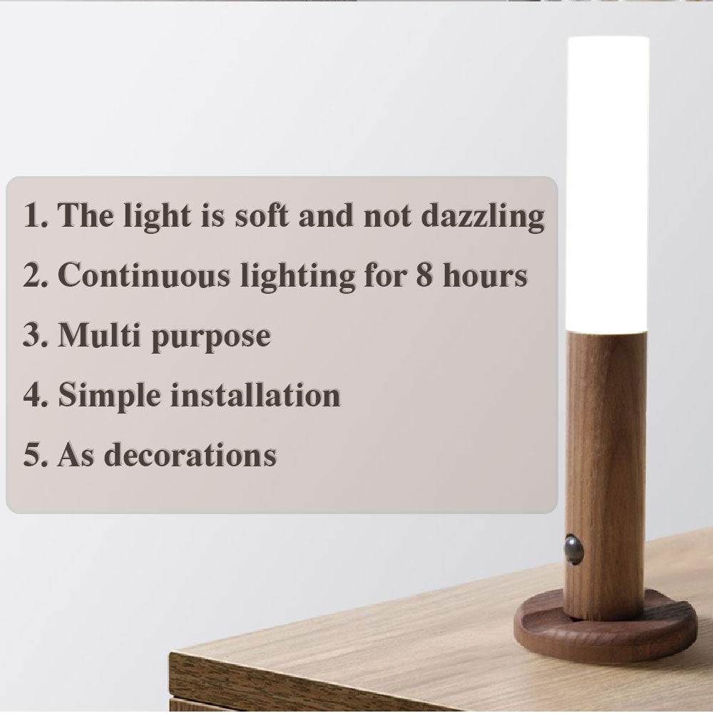 Wood magnetic night light on tabletop with white cylinder and sensor dot