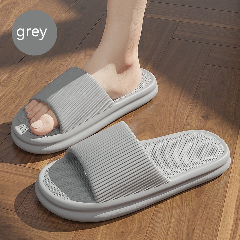 Grey striped slip-on home slippers with textured sole and open toe